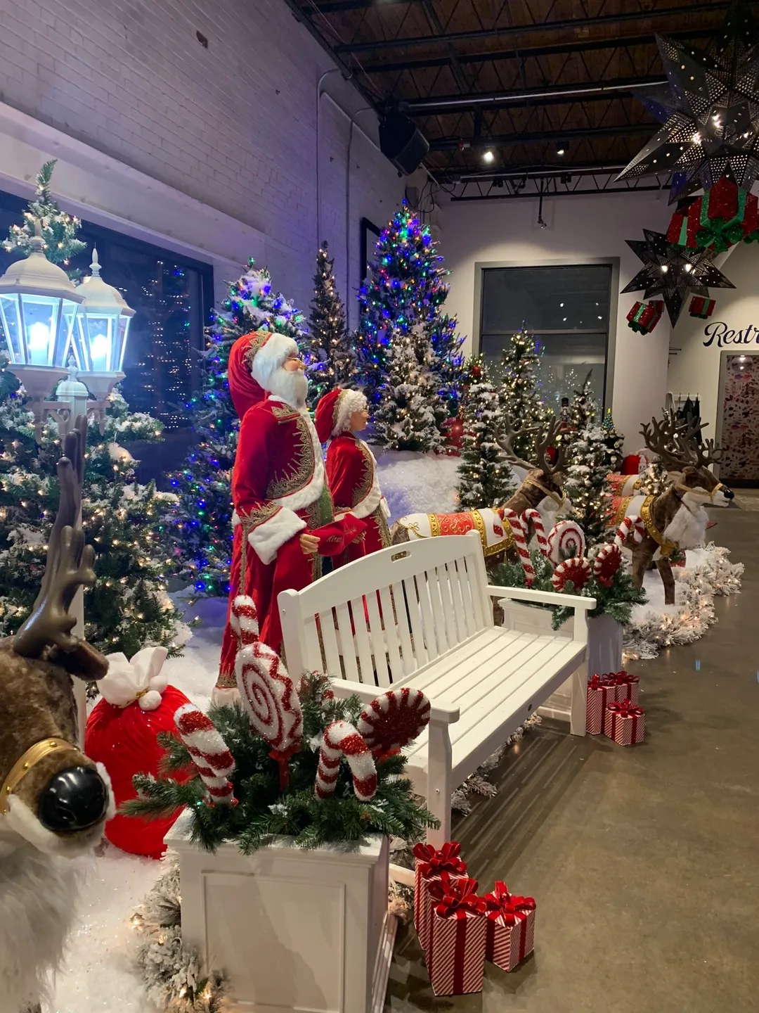 A white bench with santa claus on it