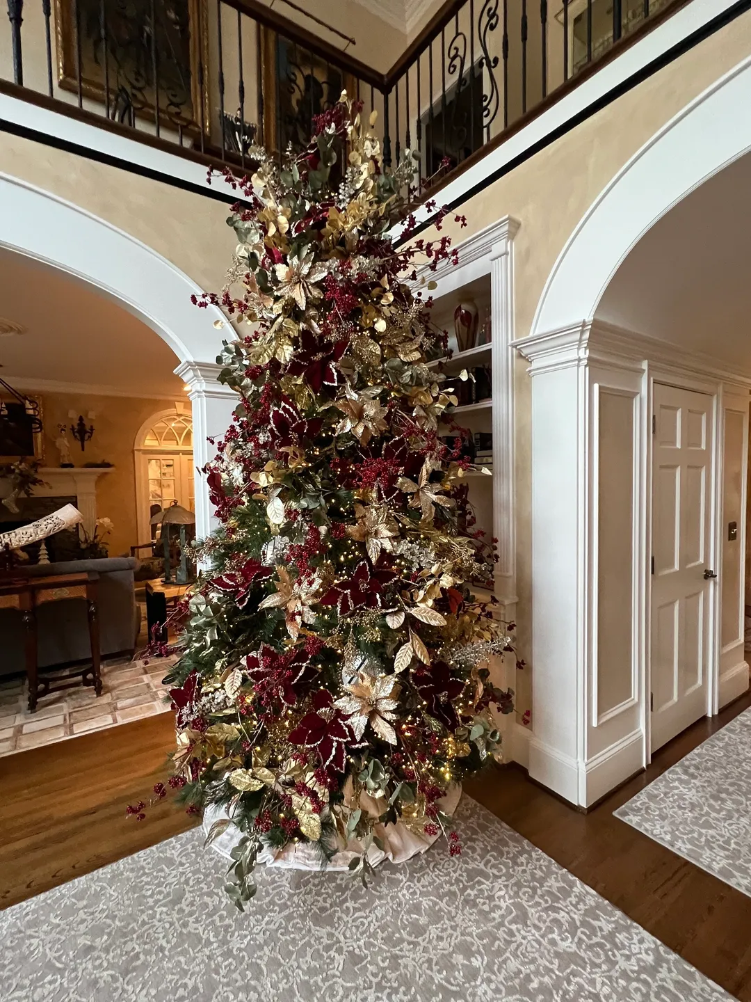 A christmas tree in the center of a room.